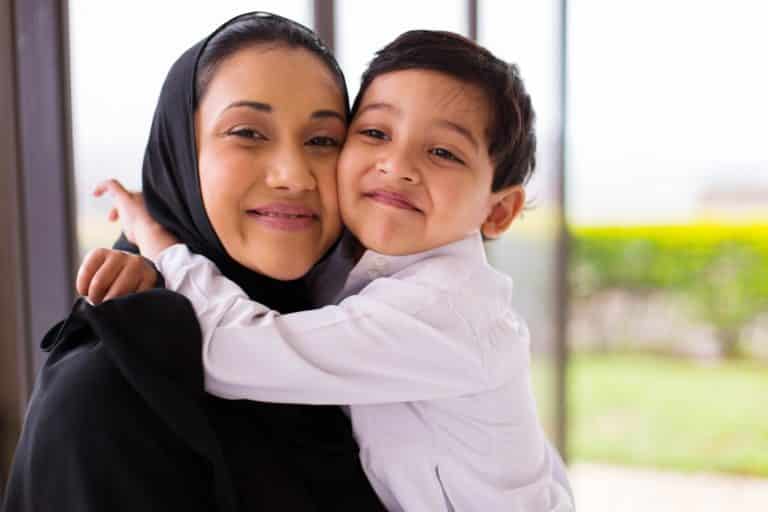 boy hugging his mother