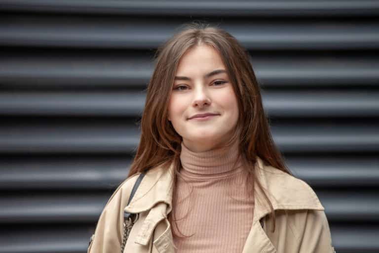 Outdoors portrait of 17 year old teenage girl with long brown hair