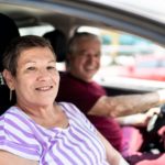 Portrait of senior couple inside a car