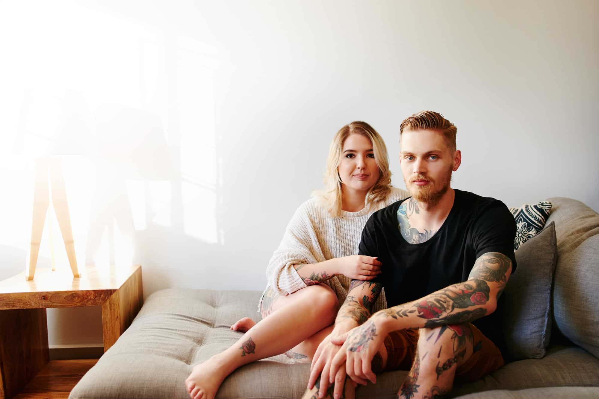 Portrait of a young couple relaxing at home