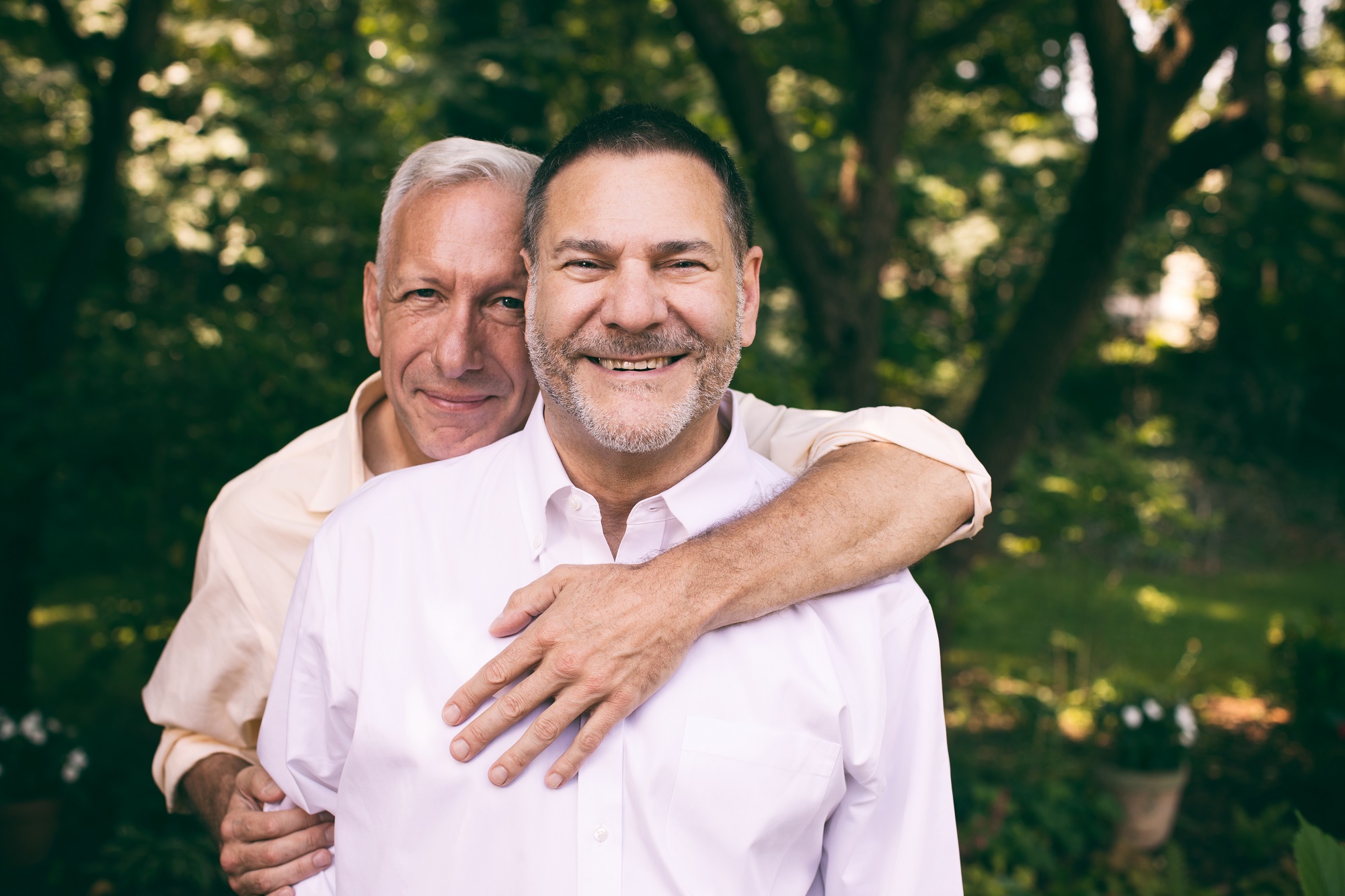 portrait of a loving middle-aged couple surrounded by nature.